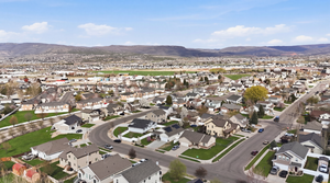 Aerial view of residential area with a mountain backdrop