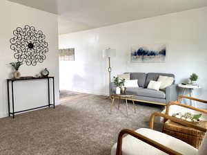 Large living room with fresh paint, new carpet, and new windows