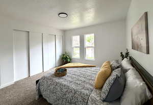 Large main floor primary bedroom with fresh paint, new carpet, 2 closets, and new windows