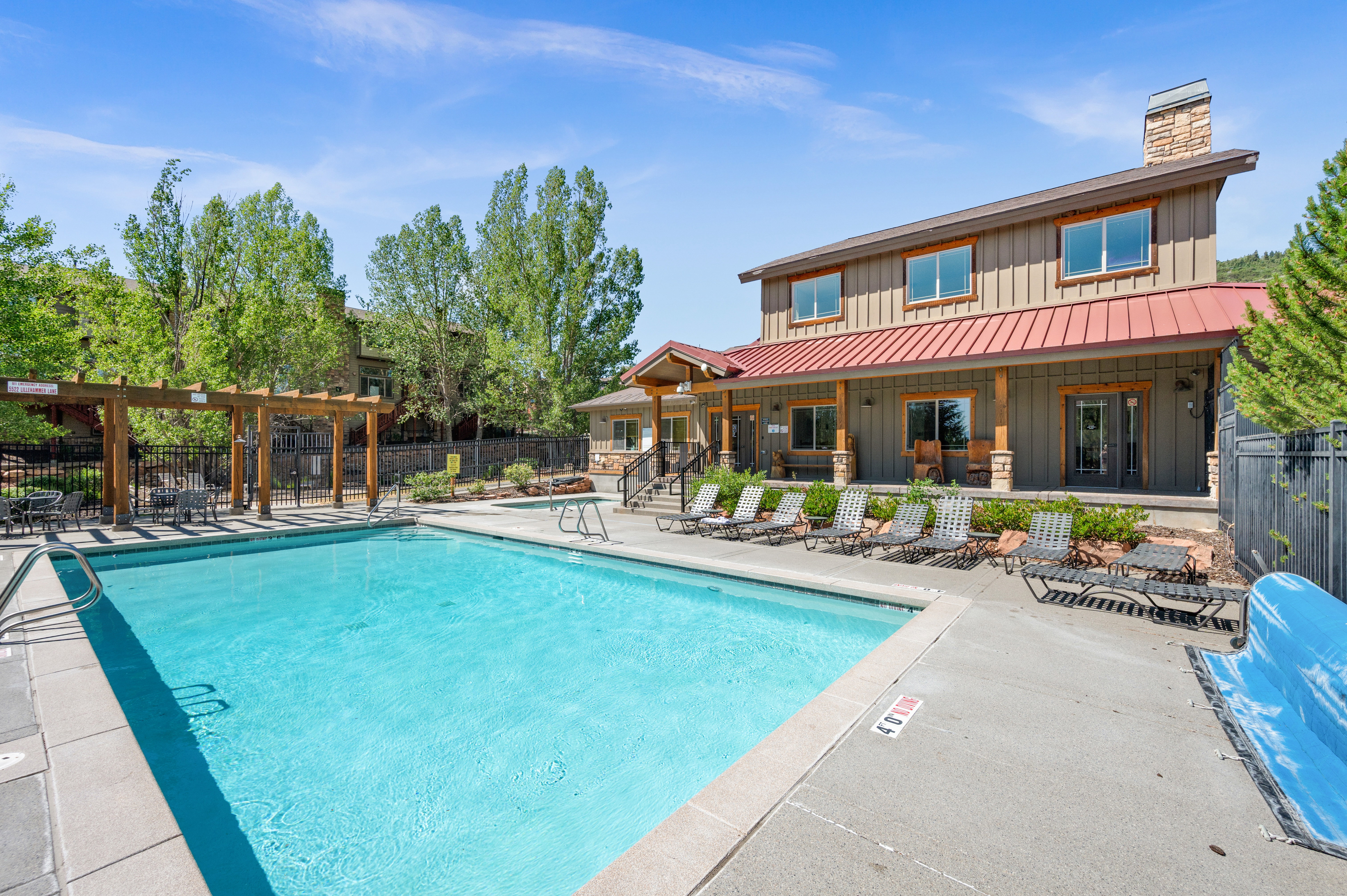 Outdoor swimming pool with concrete decking