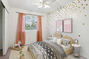 Bedroom featuring carpet floors, a ceiling fan, and a closet