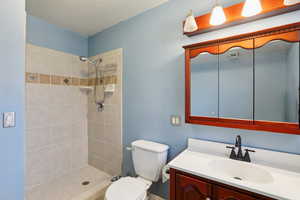 Bathroom with vanity and a shower stall