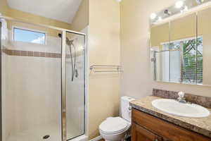 Full bathroom featuring a shower stall and vanity