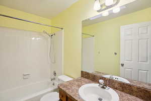 Bathroom featuring vanity and tub / shower combination