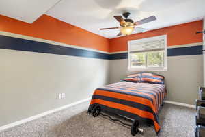 Bedroom with carpet and a ceiling fan