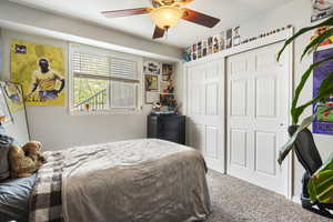 Bedroom featuring carpet, a closet, and ceiling fan