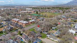 Aerial overview of property's location featuring a mountain backdrop and nearby suburban area