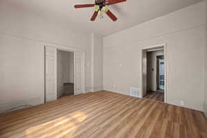 Unfurnished bedroom featuring light wood finished floors and a ceiling fan