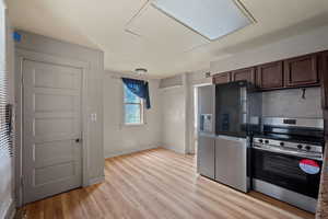Kitchen with stainless steel appliances and light wood-type flooring