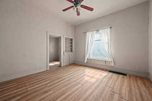 Unfurnished bedroom featuring light wood-type flooring and a ceiling fan