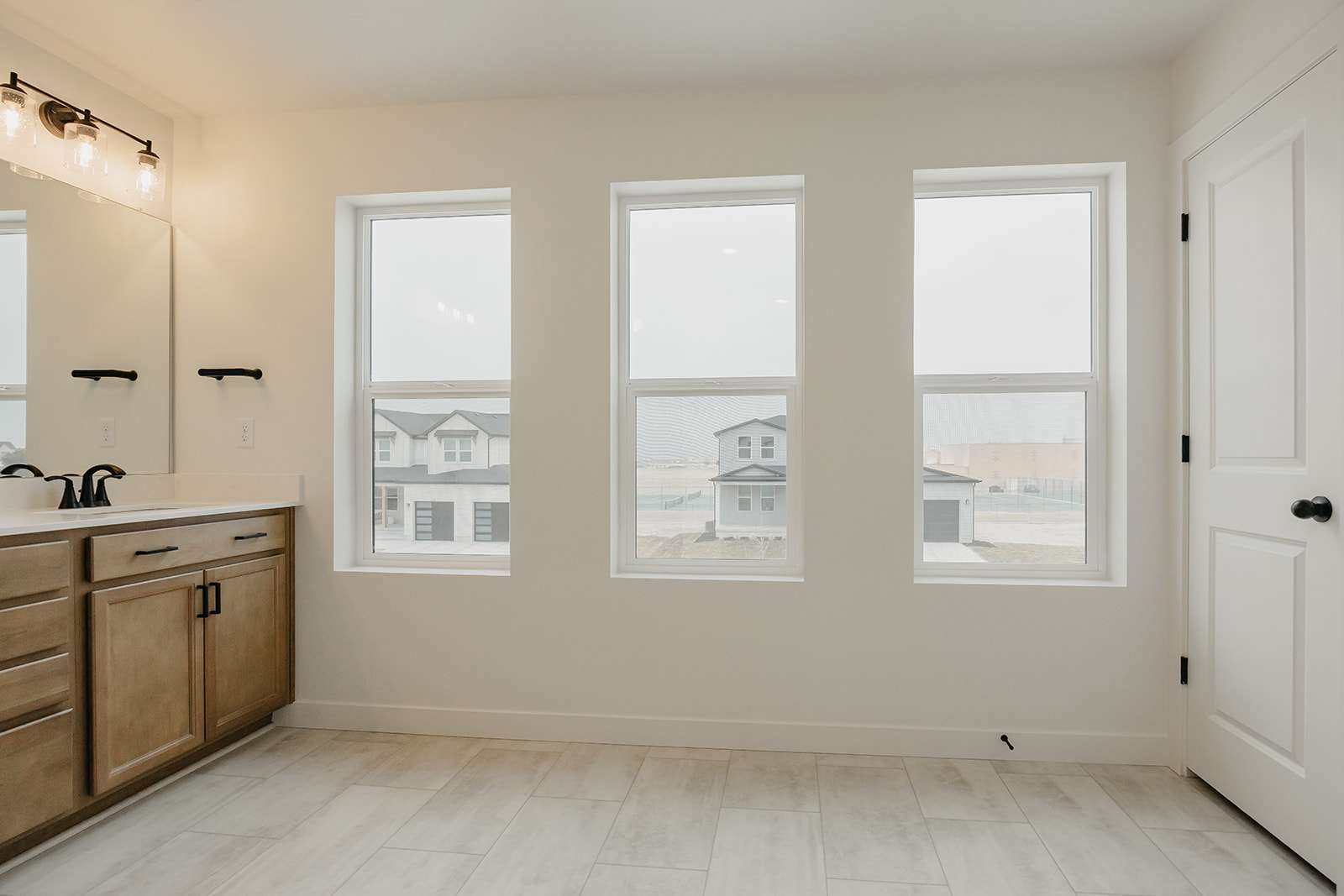 Bathroom with vanity and baseboards