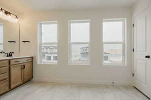 Bathroom with vanity and baseboards