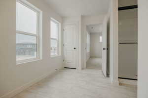 Corridor featuring baseboards