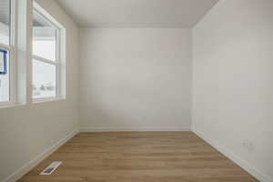 Unfurnished room featuring light wood finished floors