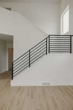 Staircase with wood finished floors