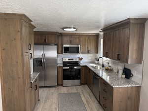 Newly Updated Custom Cabinets/Granite Countertops/ Flooring/Stainless Steel appliances!