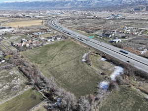 Aerial overview of property's location with a mountain backdrop and rural landscape