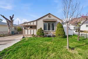View of front of house featuring concrete driveway