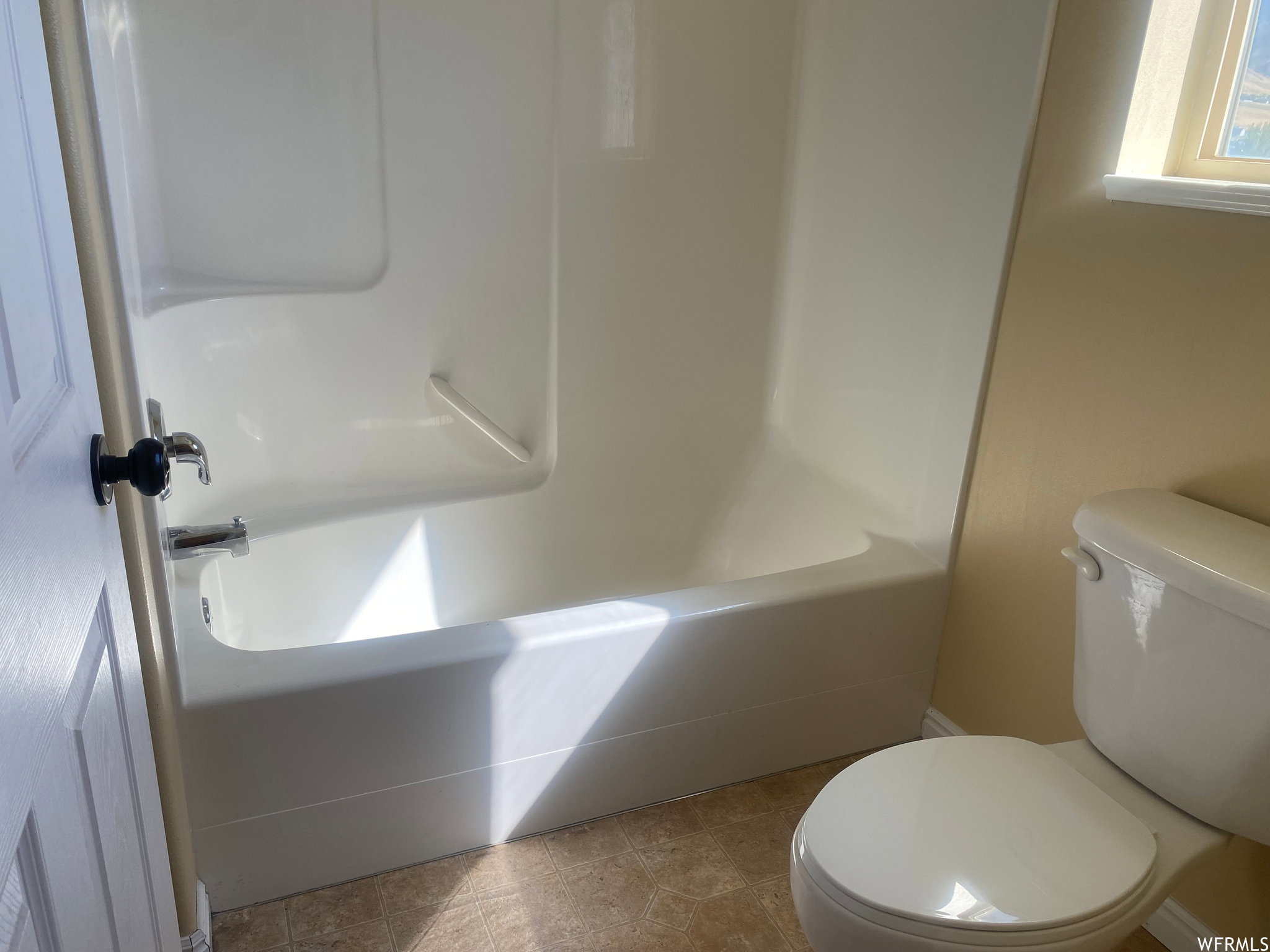 Bathroom with a shower and a tub