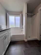 Primary full bathroom with separate bathtub and shower, granite countertop, soft close hinges