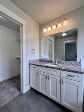 Primary full bath with access to the walk-in closet