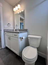 Full secondary bathroom with tub/shower combination, granite countertops, LVP flooring