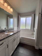 Primary full bathroom with separate bathtub and shower, granite countertop, soft close hinges