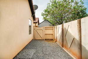 View of yard featuring a gate