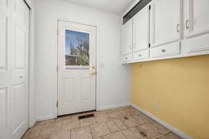 Laundry area with baseboards