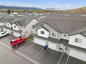 Aerial perspective of suburban area with a mountainous background