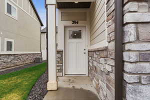 Property entrance with stone siding