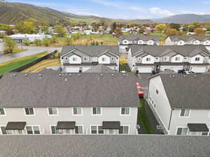 Aerial view of residential area with a mountainous background