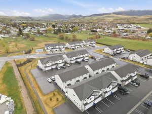 Aerial perspective of suburban area with a mountain backdrop
