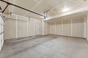 Garage featuring a garage door opener