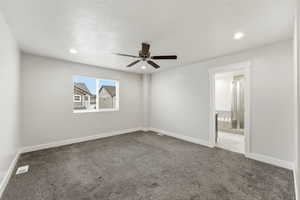 Carpeted spare room featuring ceiling fan, recessed lighting, and a textured ceiling