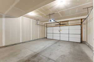 Garage featuring a garage door opener