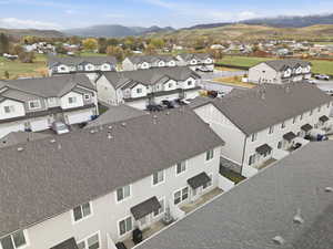 Aerial perspective of suburban area with a mountain backdrop