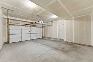 Garage featuring a garage door opener