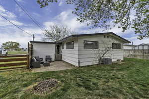 Rear view of property with a patio area and outdoor lounge area