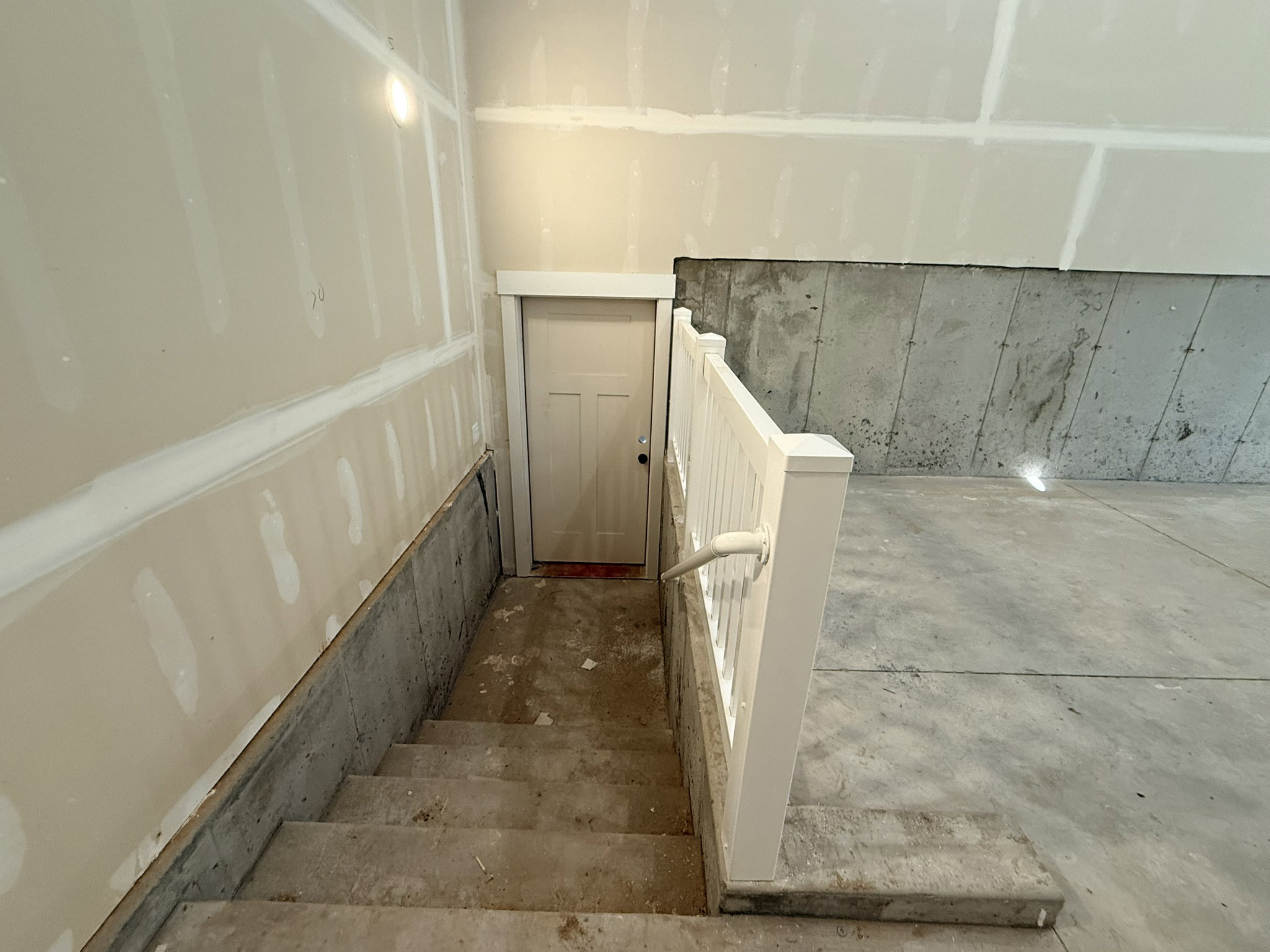 Stairs featuring concrete floors