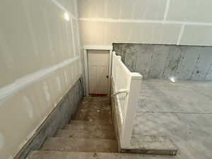 Stairs featuring concrete floors