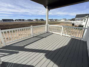 Wooden deck with a residential view