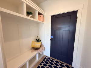 Mudroom featuring dark wood-type flooring