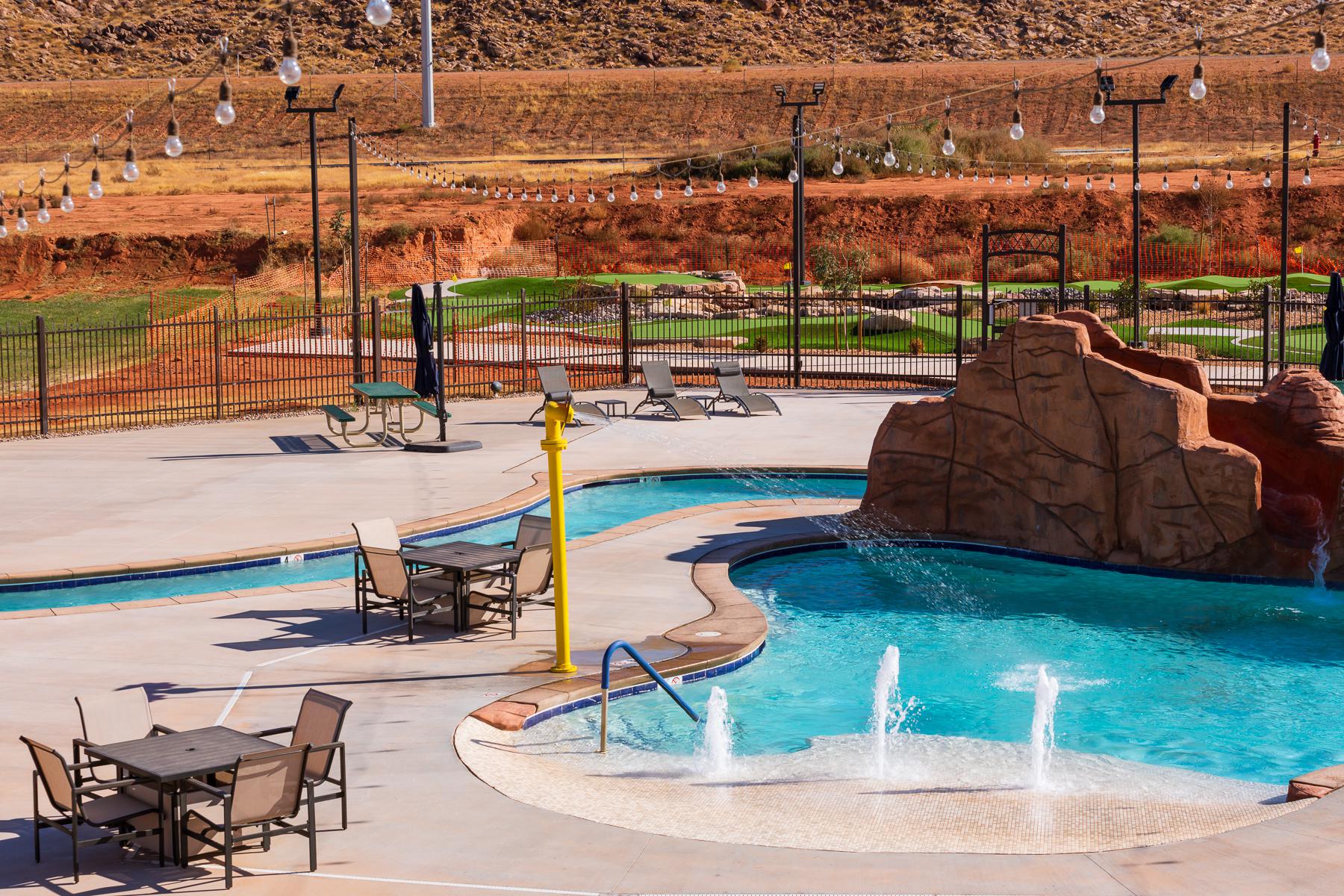 Community pool with a patio