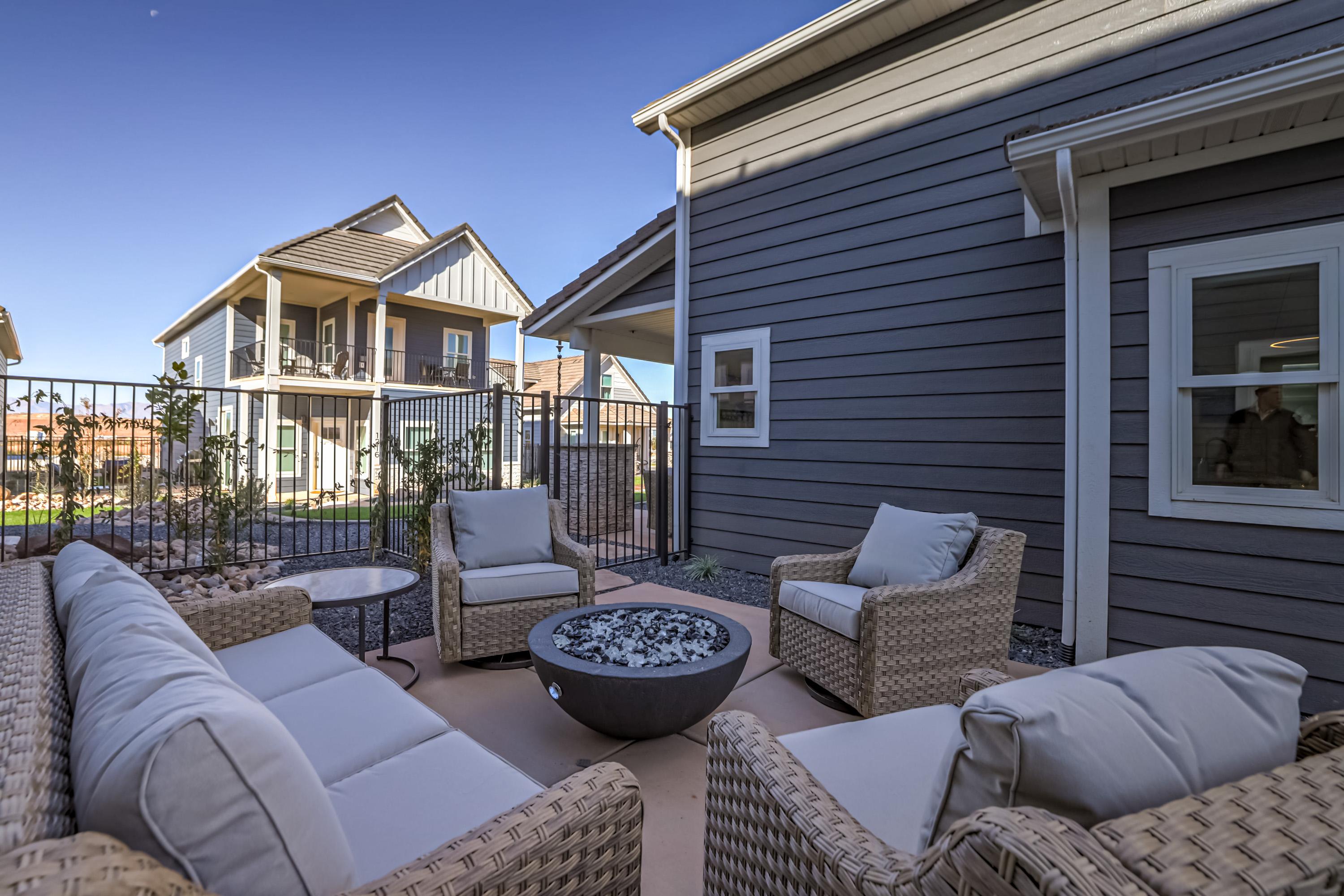 View of patio featuring an outdoor living space with a fire pit