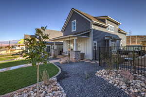 View of front of property featuring board and batten siding, a porch, and a mountain view