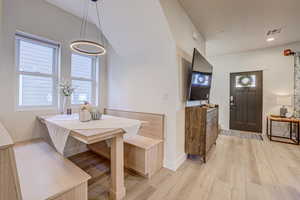 Dining area featuring breakfast area and light wood finished floors