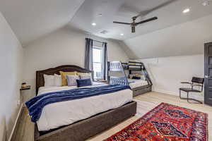 Bedroom with light wood finished floors, recessed lighting, lofted ceiling, and ceiling fan