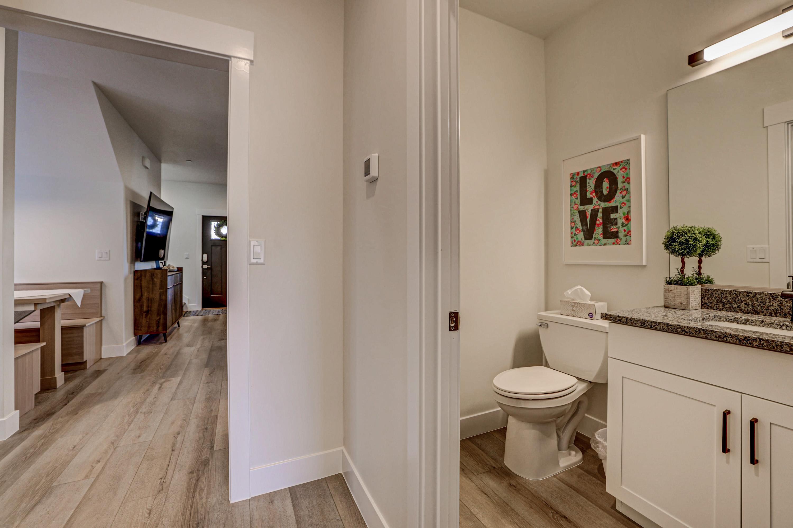 Bathroom with vanity and light wood finished floors
