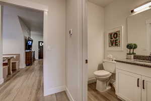 Bathroom with vanity and light wood finished floors